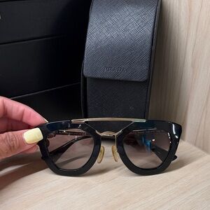 Prada Black Cat-Eye Sunglasses with Gold Bridge